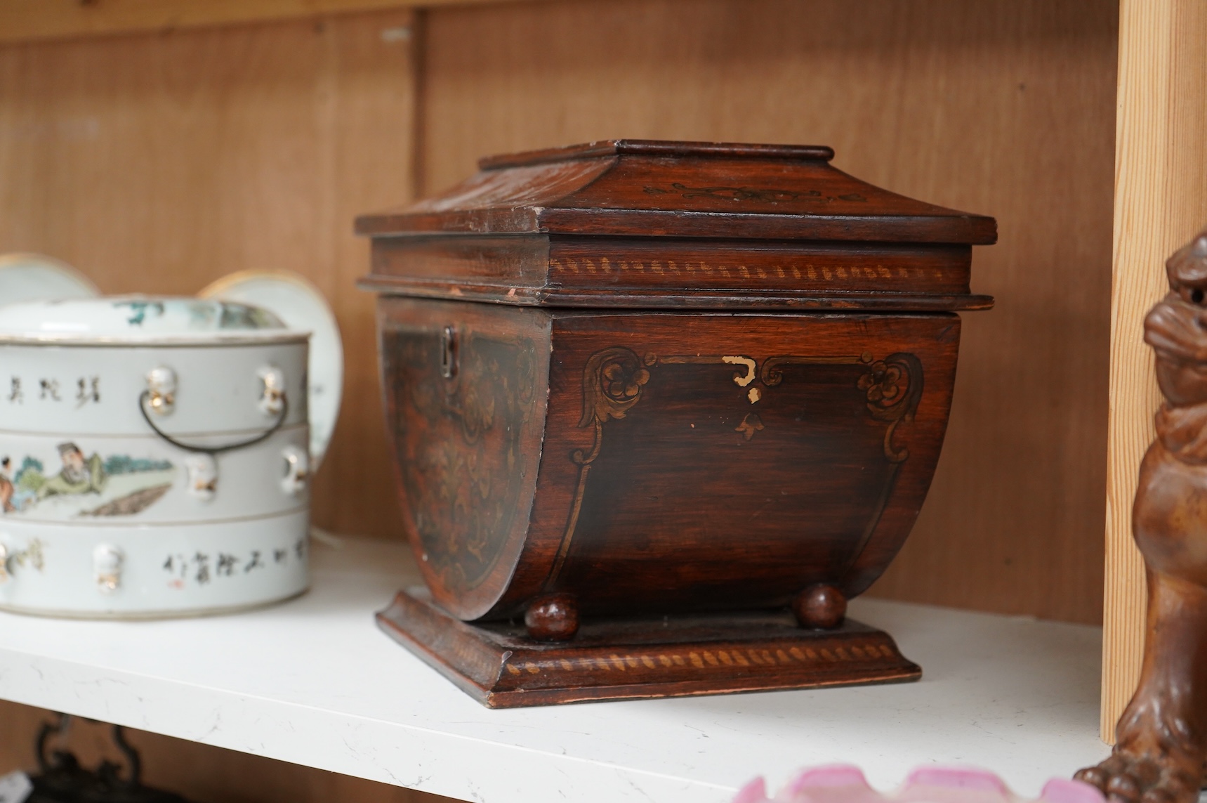 A late 19th century Grecian revival mahogany and penwork sarcophagus shaped tea caddy, 28cm wide